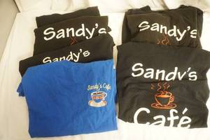 lot 186 image: Sandys Cafe Black T-Shirts 8ct (used, some have stains)