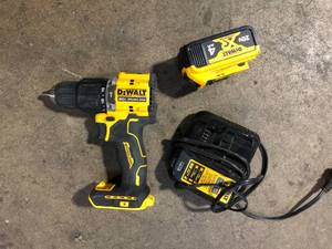 lot 56 image: DEWALT ATOMIC 20V Lithium-Ion Cordless 12 in. Hammer Drill Kit with 5.0 Ah Battery and Charger Good Used   Customer Returns See Pictures