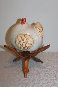 lot 7 image: Ceramic Chicken Figurine on Carved Wooden Stand