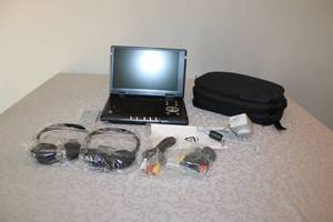 lot 29 image: Portable DVD Player with Accessories and Carrying Case