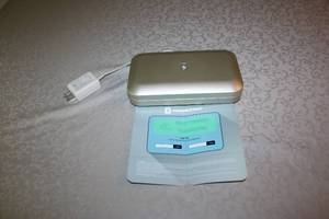 lot 57 image: PhoneSoap UV Smartphone Sanitizer with Power Adapter and Manual