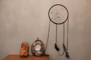 lot 144 image: Dreamcatcher, Rustic Wood Slice Coasters, and Sand Dollar Ceramic Mirror Set