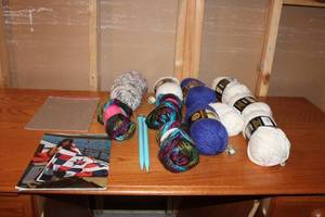 lot 159 image: Collection of Yarn Skeins, Knitting Needles, and Pattern Booklet