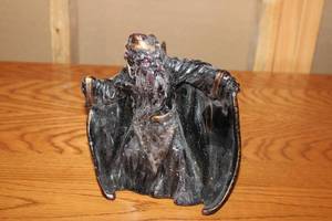lot 174 image: Vintage Wizard Figurine with Black Robes and Red Eyes