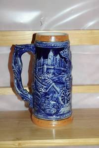 lot 194 image: Blue German-Style Beer Stein with Relief Design and Las Vegas Motif