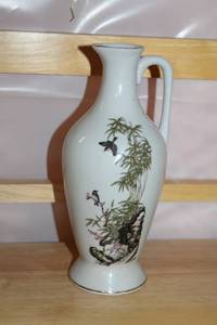 lot 201 image: Porcelain Pitcher with Bird and Bamboo Design