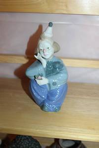 lot 208 image: Porcelain Clown Figurine with Flower