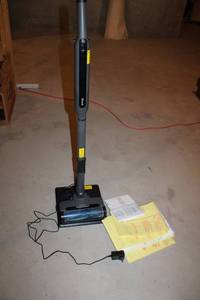 lot 228 image: Shark Cordless Stick Vacuum with Charging Adapter and Manuals
