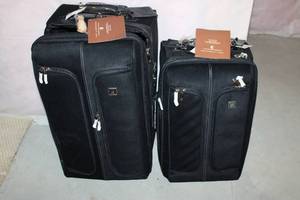 lot 234 image: Pair of Black Softside Luggage Suitcases with Tags