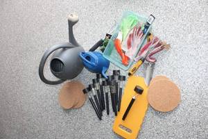 lot 303 image: Gardening Tool Set with Watering Cans, Gloves, and Accessories