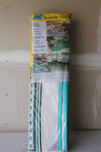 lot 315 image: Unopened Reversible Patio Mat Indoor Outdoor Mold and Mildew Resistant