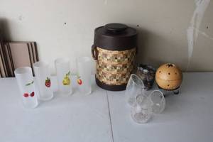 lot 337 image: Mixed Home Decor and Barware Collection with Ice Bucket, Glasses, and Decorative Items