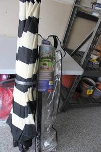 lot 345 image: Black and White Stripe Adjustable Patio Umbrella with Aluminum Pole