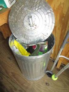 lot 224 image: Metal trash can with lid containing...