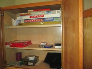 lot 58 image: Oak cabinet filled with games and c...