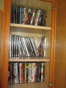 lot 60 image: Oak cabinet filled with DVDs measur...