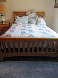 lot 90 image: Wood Queen bed frame with all pillo...
