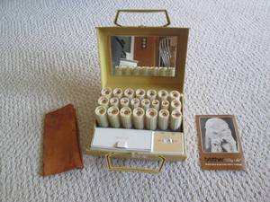 lot 112 image: Vintage Brother hair curling kit...