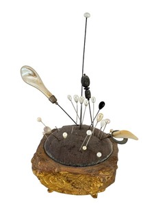 lot 35 image: Antique Victorian Metal Pin Cushion with Assorted Hat Pins