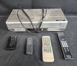 lot 32 image: Sylvania DVD VCR Combo Player Model 6903DD with 4 Remotes - untested