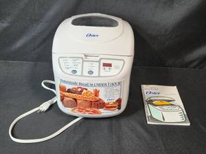 lot 59 image: Oster 2 lb. Expressbake Breadmaker Model 5838 with Manual