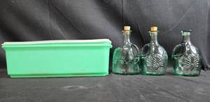 lot 67 image: Set of Green Embossed Glass Bottles with Corks and Vintage Tupperware Container