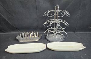 lot 71 image: Metal TacoToast Rack, Chrome Keurig Pod Stand, and Pair of Ceramic Platters