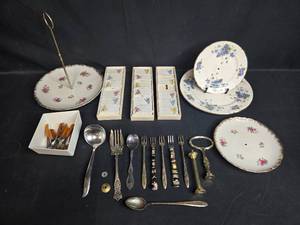 lot 87 image: Vintage Mixed Porcelain TieredHandled Plates, Place Card Holders, and Assorted Flatware Lot