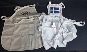 lot 88 image: Set of 2 Aprons with Embroidery and Swedish Flag Motif