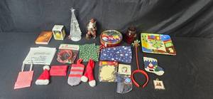 lot 140 image: Holiday Decor Collection with Painted Plate, Stockings, Ornaments, and Santa Figurine