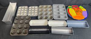 lot 166 image: Collection of Bakeware and Decorative Plates Including Muffin Pans, Loaf Pans, Pizza Pan, and Fruit Plate