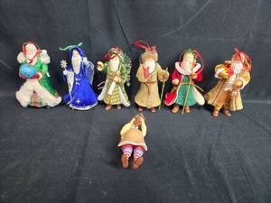 lot 179 image: Set of Holiday Santa Figurines with Various Outfits and Accessories