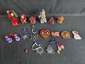 lot 182 image: Collection of Assorted Holiday Ornaments Including Santas, Patriotic, and Crystal Designs