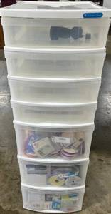 lot 255 image: Plastic 6-Drawer Storage Tower with Craft Supplies, Ribbons, and Tape - wheels in drawer untested