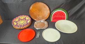 lot 276 image: Assorted VTG Decorative Plate and Tray Collection Including Wood, Metal, Ceramic, and Woven Pieces
