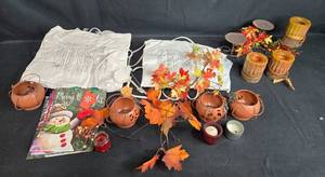 lot 296 image: Autumn Decor Collection with Candle Holders, Artificial Leaf Garland, Heating Pads, and Accessories
