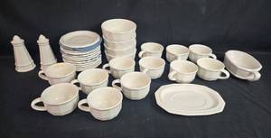 lot 341 image: White Stoneware Dinnerware Set with Cups, Bowls, Plates, Gravy Boat, and Shakers