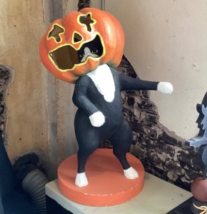 lot 194 image: Paper Mache Black Cat with Jack-o-Lantern on Head