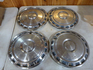 lot 78 image: 4 Datsun B-201 Hub Caps