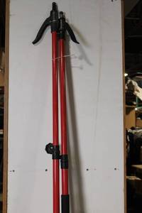 lot 69 image: Pair of 78-Inch Red Adjustable Pole Clamps