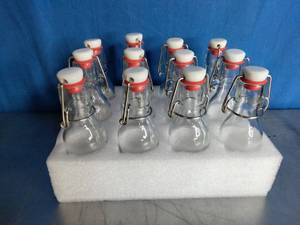 lot 75 image: 12 Pack 4oz Swing Top Glass Bottles