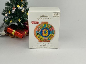 lot 25 image: 2010 Fisher Price The Zoo Keeper Says Hallmark Keepsake Christmas Ornament
