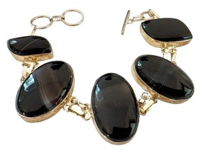 lot 61J image: 8 Sterling Silver Polish Agate Bracelet