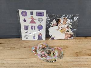 lot 287 image: Taylor Swift Temporary Tattoos, 8 Friendship Bracelets & Cupcake Toppers - Brand New