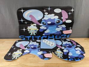 lot 206 image: Disneys Stitch 4-Piece Bathroom Set Rugs, Toilet Cover, Shower Curtain with Hooks - Brand New