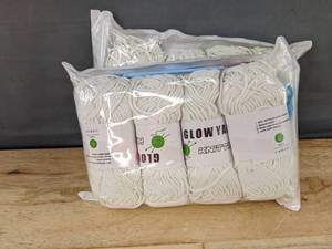 lot 210 image: 8 Rolls Glow In The Dark White Yarn With Crochet Needle - Brand New