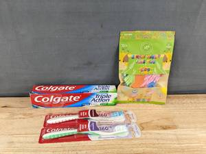 lot 251 image: Colgate Oral Care Supplies Triple Action Toothpaste, 2 Toothbrushes, Kids Floss Picks - Brand New