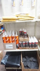 lot 64 image: Utility Knives, Adhesive Methyl Hydrate, foam sanding squares, heavy duty rain gear and more