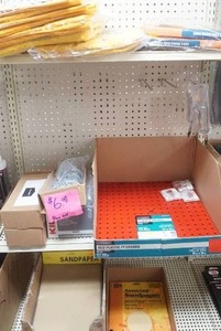 lot 65 image: heavy duty rain gear, peg hooks, peg board, sandpaper
