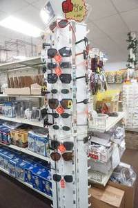 lot 133 image: Sunglasses & Display Stand